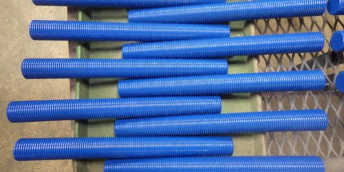 Several Teflon-coated (PTFE coated) stud bolts, all blue in color.