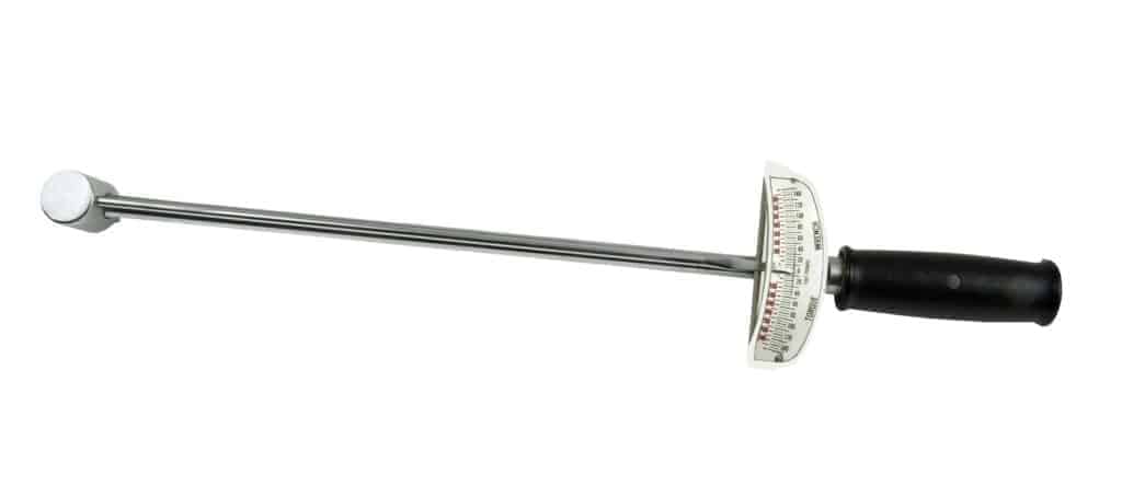 A beam type torque wrench has a torque gauge near the handle. 