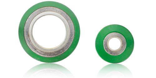 Two green spiral wound gaskets on white background.